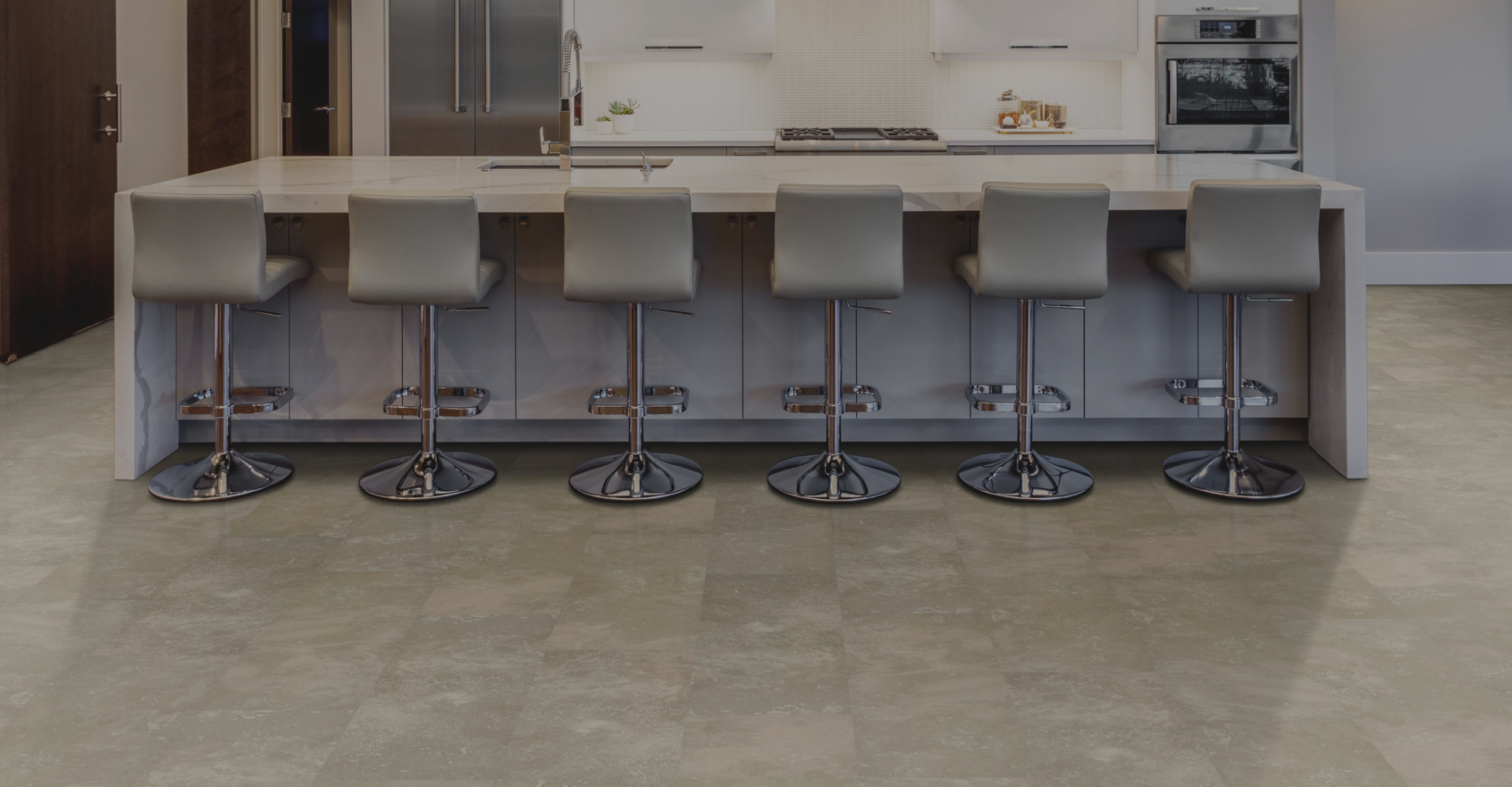 Tile flooring in a modern kitchen with white cabinetry