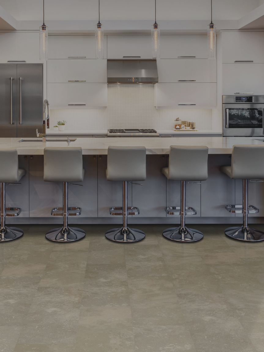 Tile flooring in a modern kitchen with white cabinetry