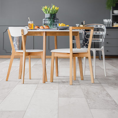 stone look large format luxury vinyl tile flooring in dining room